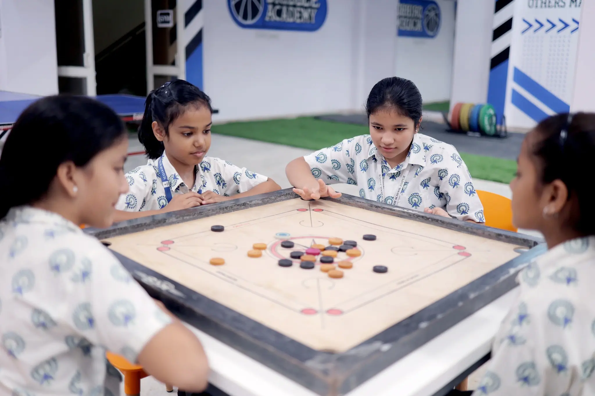 Students playing carrom