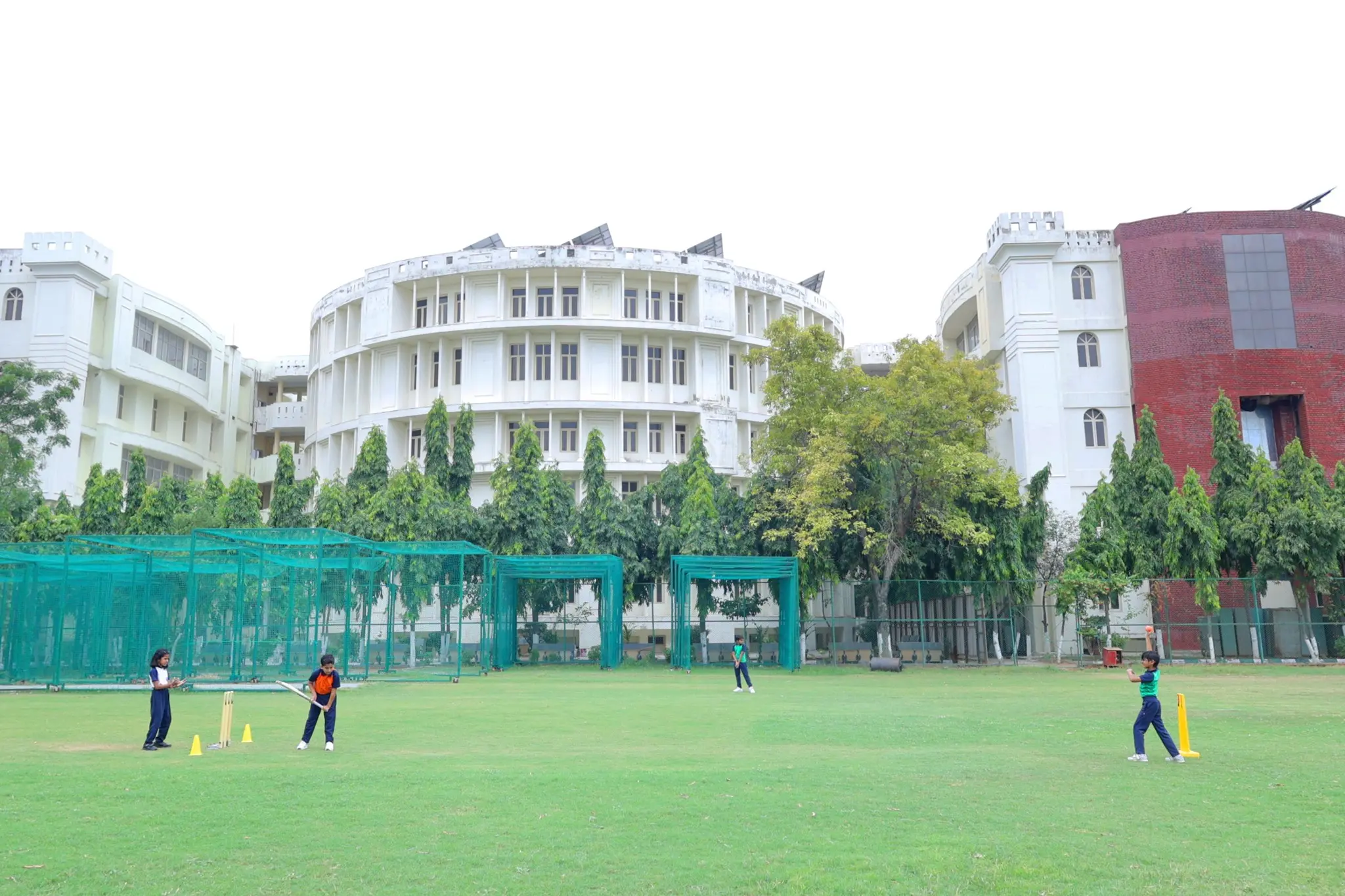 students playing cricket